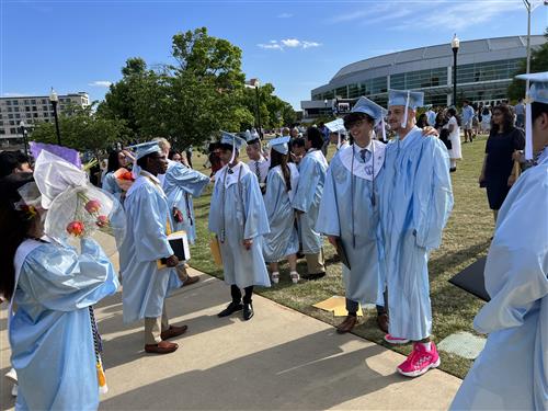 james clemens students in caps and gowns outside